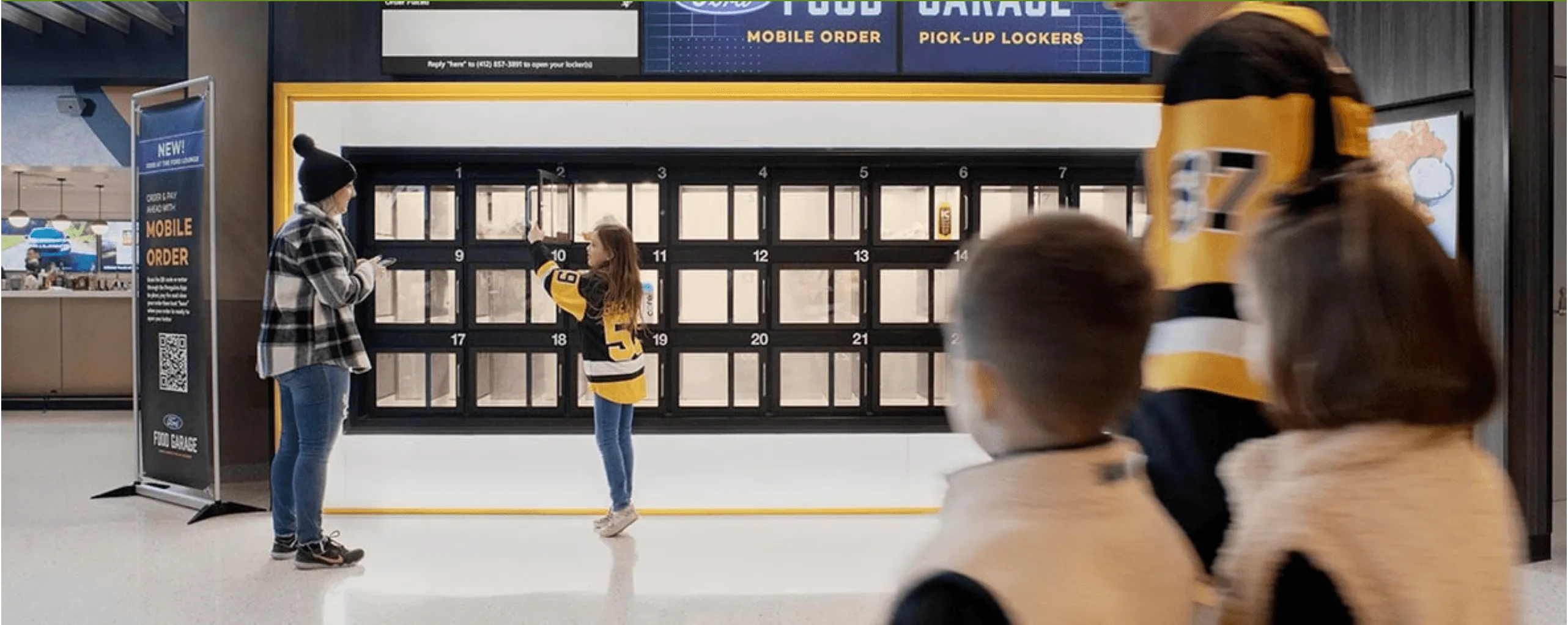 Chekt smart pickup lockers in use, with customers collecting mobile food orders from the pod